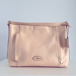 Coach leather purse in millennial pink.